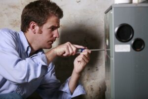 Technician working on a furnace.