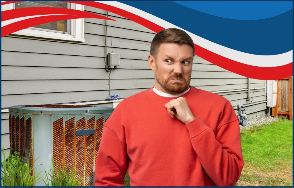 This is an image of an old AC Unit on the side of a house with a man making a face due to the AC unit's age and smell.